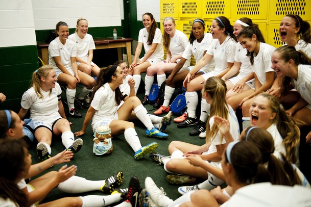 The Skyline High School soccer team laughs in the locker room during the first weather delay of the game against Huron on Thursday, May 30. Daniel Brenner I AnnArbor.com